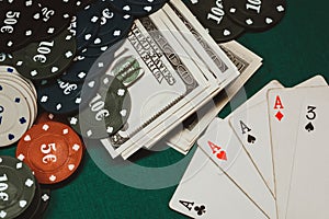 Winning combination of cards in poker on the background of money and game chips