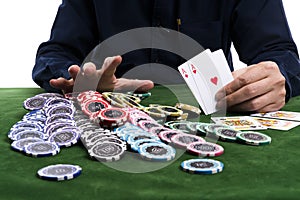 The winning gambler hand grabbing a pile of chips