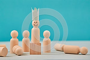 Winning, leadership. Winner and defeated. Crowned person figure with smiling emoji on wooden block, losers on floor