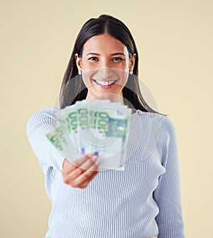 Winning money and financial success of happy woman saving cash for a banking budget. Portrait of an investing female