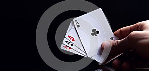 Winning poker hand of four aces playing cards