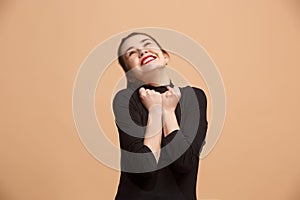 Winning success woman happy ecstatic celebrating being a winner. Dynamic energetic image of female model