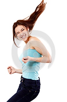 Winning teen girl happy ecstatic gesturing success.