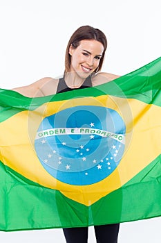 Winning woman holding Brazil flag on white background