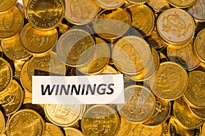 Winnings sign at a coin stack