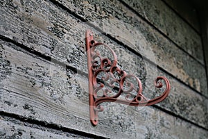 Wintage wood wall with lonely flower holder