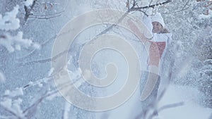 Winter Activities. Mother and Cute Child are Playing with Snow