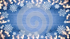 Winter / Advent / Christmas / holiday Background template - Frame made of ice crystals and sparkles bokeh lights on blue wooden