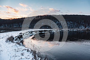 Winter aerial sunset view on river shore, Ukraine