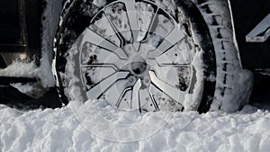 Winter all-terrain tire tread packed with snow stock photo