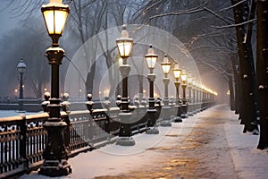 Winter alley in the park with lanterns and falling snow, Moscow, Russia