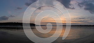 Winter Angara by the river at sunset