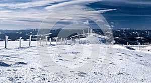 Winter austrian mountains panorama with blue sky and clouds