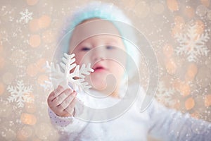 Winter Baby Showing Christmas Ornament