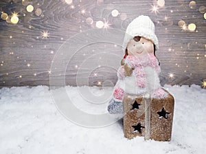 Winter background with girl toy decor and snow