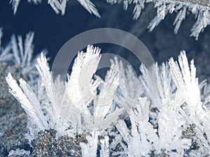 Winter background with snowflakes crystals patterns and snow on frozen grass