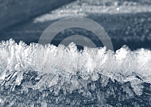 Winter background with snowflakes crystals patterns and snow on frozen grass