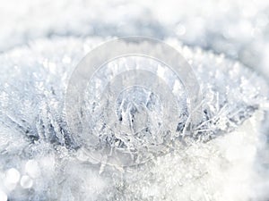 Winter background with snowflakes crystals patterns and snow on frozen grass