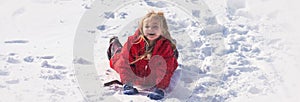 Winter banner. Cute girl playing in snow. Child in snow. Kid winter portrait. Cute child in frosty winter Park. Happy