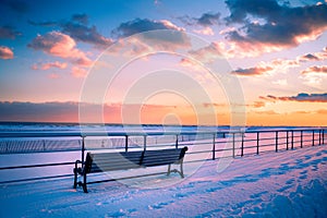 Winter Beach Scene with snow at sunset