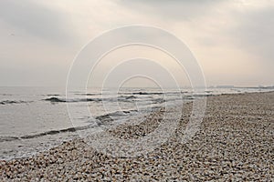 Winter beach of shells at black sea