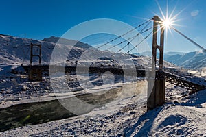 Winter. Beautiful old bridge. Sun