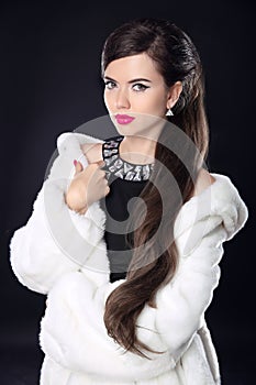 Winter Beauty Woman in Luxury white Fur Coat. Fashion Model Girl