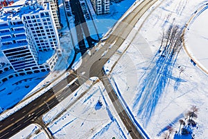Winter begins in modern residential area in Minsk, aerial landscape