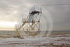 Winter on the Black Sea coast in the city of Yuzhny. View of the empty rescue tower