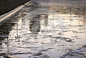 Winter blue ice, the Moscow river and Christ Redeemer cathedral reflection.