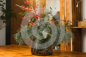 Winter bouquet in vase for home interior decoration. Christmas flower arrangement