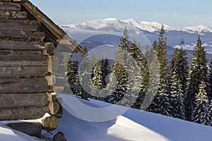 Winter Carpathian Mountains, Chornohora region, Ukraine. Wooden shepherds cradle on the meadows in the Carpathians in winter. Wint