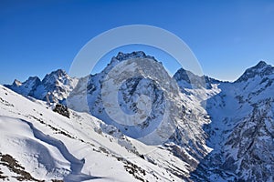 Winter Caucasus mountain ranges in Dombay