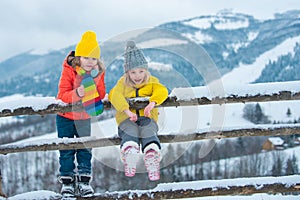 Winter children friends. Kids enjoying nature wintertime. Winter child happy. People in snow. Theme Christmas holidays