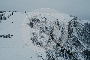 Winter chill. Natural winter landscape from air. Aerial view on the road and forest at the winter time. Forest and snow