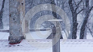 Winter Chimney Smoke in the Snowfall.