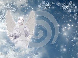 Winter Christmas angel with snow and sky and copy space