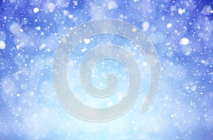 Winter christmas background with shiny snow flakes and blizzard photo