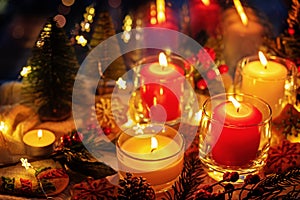 Winter Christmas holidays background with candles; christmas light; Cup of cocoa with marshmallow or hot chocolate near a windo