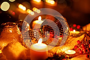 Winter Christmas holidays background with candles, christmas light, toy near a window