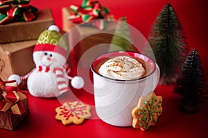 Winter Christmas holidays background with Cup of cocoa or hot chocolate with whipped cream with cinnamon sprinkles