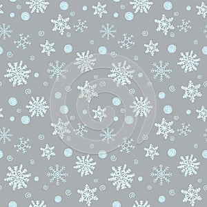 Winter Christmas seamless pattern, festive. Falling snow, snowflakes, curlicues, snow balls. Suitable for gift wrapping, fabric