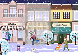 Winter Christmas street of small city. View of city street with shops and coffee house in winter. Snowy roadway with