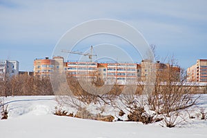 Winter city landscape with new high-altitude houses