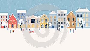Winter city panorama with people walking on street in snow on Christmas holidays. European Old town with cozy buildings