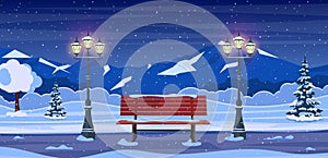 Winter city park with wooden bench,