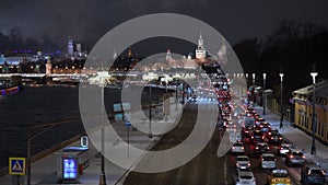 Winter cityscape at night. Traffic jam near the Moscow Kremlin in winter and evening