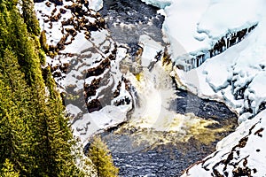 Winter close up of Lee Falls, the bottom portion of Helmcken Falls, on the snow covered Murtle River