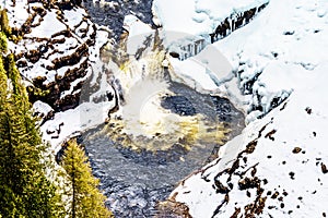 Winter close up of Lee Falls, the bottom portion of Helmcken Falls, on the snow covered Murtle River