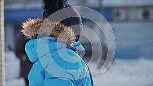 Winter close up outdoor portrait of adorable dreamy baby boy, happy baby boy playing in the snow, outdoors.